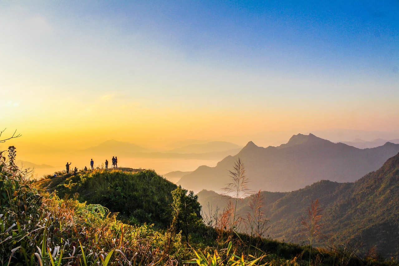 focus Photo Of People Standing On Top Of Mountain Near Grasses 733162